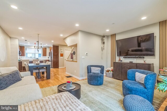 211 Brown St Unit 15, Philadelphia, PA 19123 - living area with light wood finished floors, recessed lighting, baseboards, and a chandelier