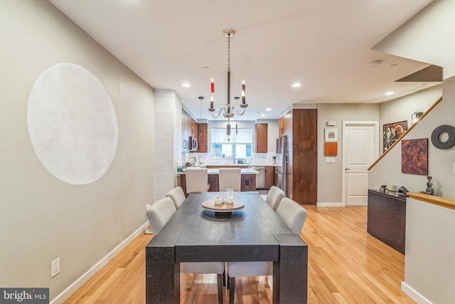 211 Brown St Unit 15, Philadelphia, PA 19123 - dining room with a chandelier, light wood-style flooring, baseboards, and recessed lighting