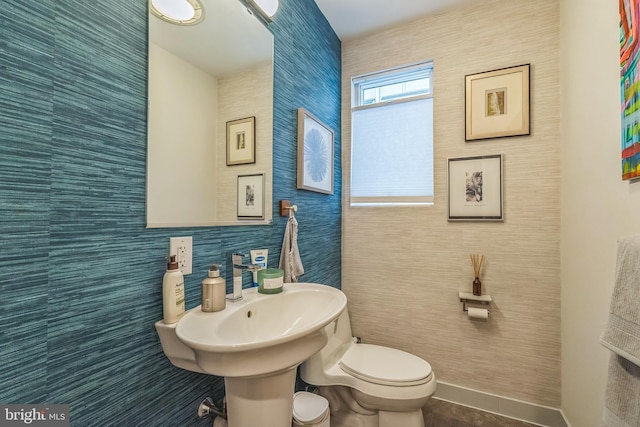 211 Brown St Unit 15, Philadelphia, PA 19123 - half bathroom featuring toilet, tile walls, and tile patterned floors