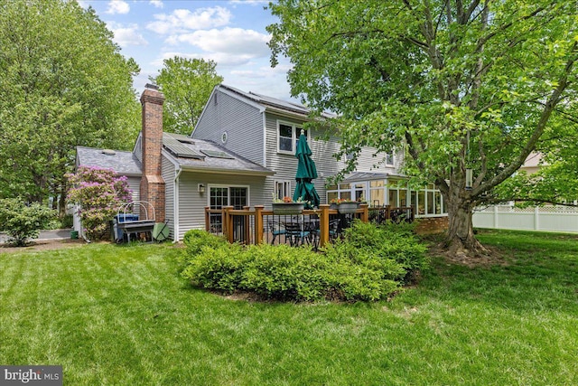 15 Hamilton Ct, Lawrenceville, NJ 08648 - back of house featuring a chimney, a yard, and a wooden deck