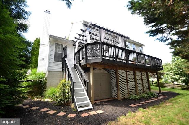 6385 Hunters Crossing Ct, Eldersburg, MD 21784 - back of property featuring a wooden deck, stairway, and a chimney