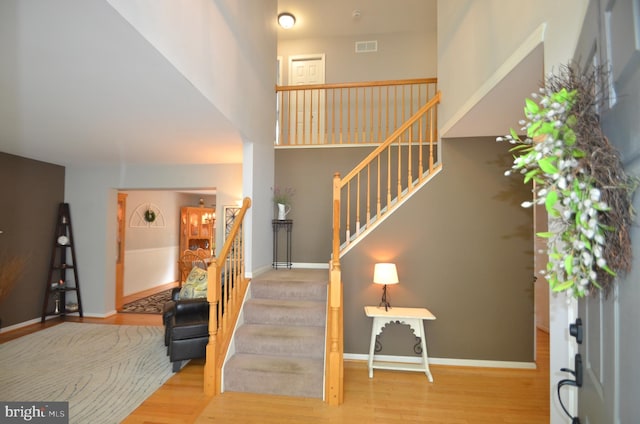 6385 Hunters Crossing Ct, Eldersburg, MD 21784 - entrance foyer with stairway, wood finished floors, and baseboards