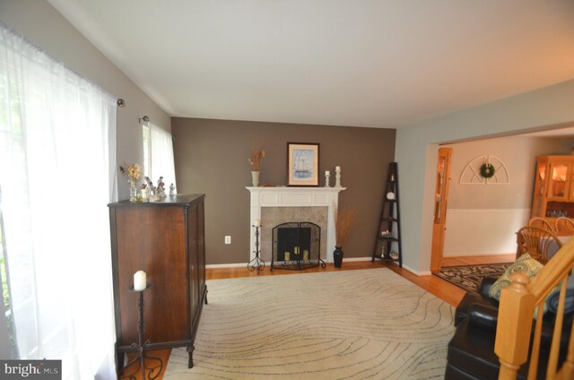 6385 Hunters Crossing Ct, Eldersburg, MD 21784 - living room with a tile fireplace and wood finished floors