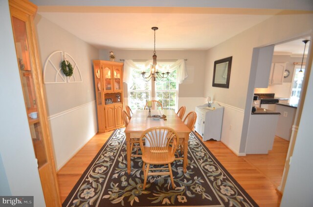 6385 Hunters Crossing Ct, Eldersburg, MD 21784 - dining room featuring a chandelier and light wood-style floors