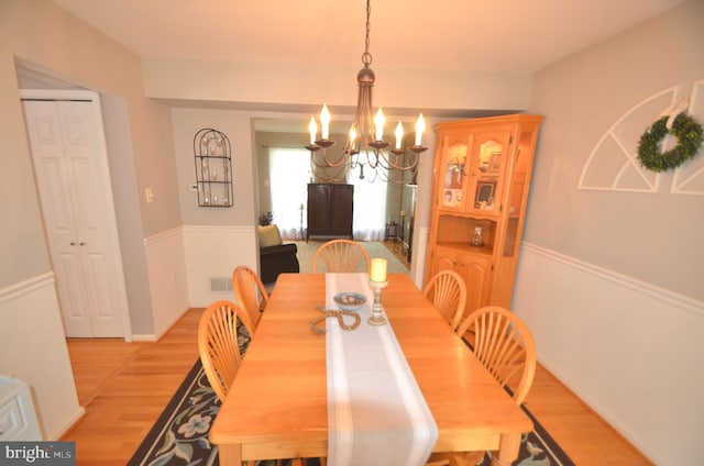6385 Hunters Crossing Ct, Eldersburg, MD 21784 - dining room featuring a chandelier and light wood finished floors