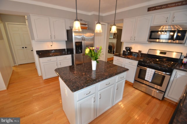 6385 Hunters Crossing Ct, Eldersburg, MD 21784 - kitchen with stainless steel appliances, light wood-type flooring, white cabinets, and crown molding