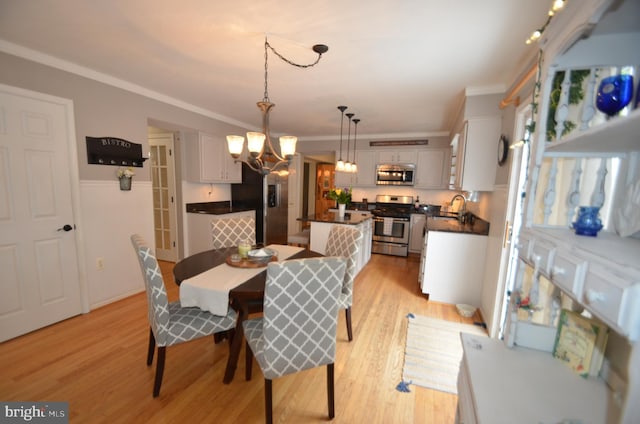 6385 Hunters Crossing Ct, Eldersburg, MD 21784 - dining space with a chandelier, ornamental molding, and light wood finished floors