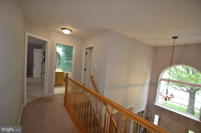 6385 Hunters Crossing Ct, Eldersburg, MD 21784 - hall with an upstairs landing, light colored carpet, and a chandelier