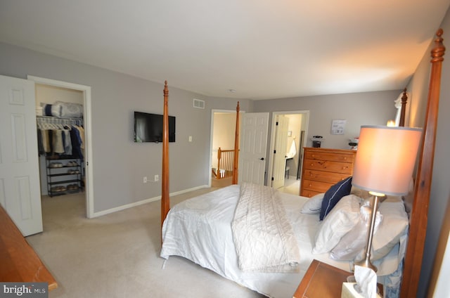 6385 Hunters Crossing Ct, Eldersburg, MD 21784 - bedroom with a walk in closet, carpet, a closet, and baseboards