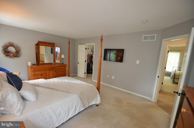 6385 Hunters Crossing Ct, Eldersburg, MD 21784 - bedroom featuring light carpet, a spacious closet, baseboards, and a closet