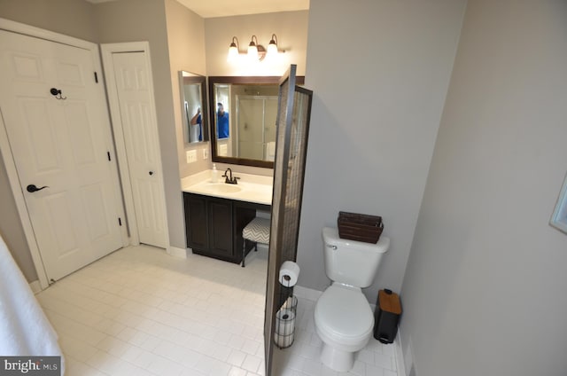 6385 Hunters Crossing Ct, Eldersburg, MD 21784 - bathroom with toilet, vanity, a stall shower, tile patterned flooring, and baseboards