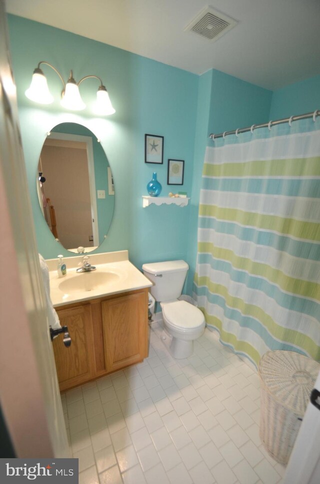 6385 Hunters Crossing Ct, Eldersburg, MD 21784 - full bathroom with vanity, tile patterned floors, toilet, and a shower with shower curtain