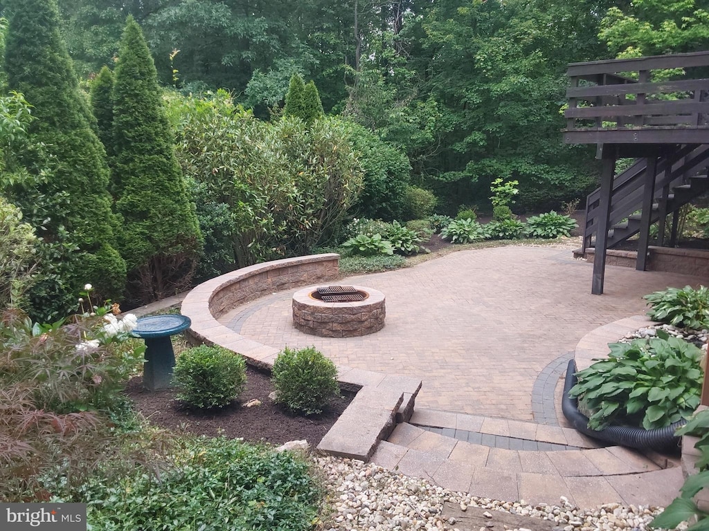 9200 Dorothy Ln, Springfield, VA 22153 - view of patio / terrace featuring an outdoor fire pit and stairs