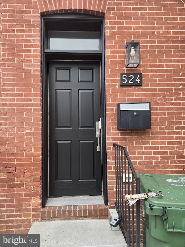 524 N Patterson Park Ave N, Baltimore, MD 21205 - doorway to property featuring brick siding