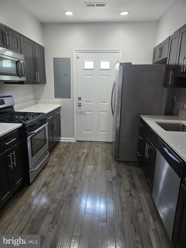 524 N Patterson Park Ave N, Baltimore, MD 21205 - kitchen with appliances with stainless steel finishes, electric panel, a sink, dark wood-style floors, and recessed lighting