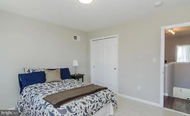 524 N Patterson Park Ave N, Baltimore, MD 21205 - bedroom with a closet, baseboards, and carpet