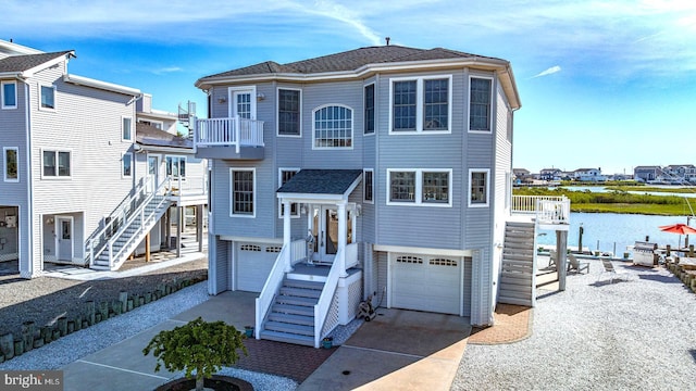39 Kentucky Dr, Little Egg Harbor Twp, NJ 08087 - view of front of house with a balcony, a garage, stairs, and driveway