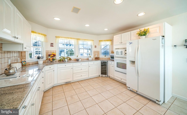 39 Kentucky Dr, Little Egg Harbor Twp, NJ 08087 - kitchen featuring white appliances, wine cooler, healthy amount of natural light, decorative backsplash, and recessed lighting