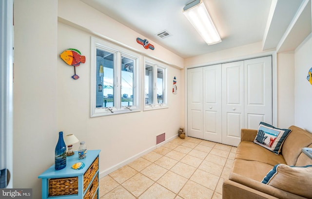 39 Kentucky Dr, Little Egg Harbor Twp, NJ 08087 - living area with light tile patterned flooring and baseboards