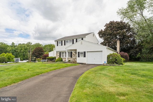 1070 Decker Ln, Warminster, PA 18974 - view of front of home featuring an attached garage, a front yard, driveway, and a chimney