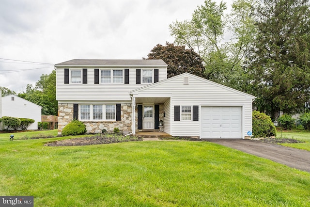 1070 Decker Ln, Warminster, PA 18974 - colonial-style house with asphalt driveway, a garage, stone siding, and a front lawn