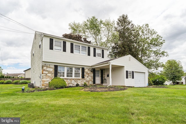 1070 Decker Ln, Warminster, PA 18974 - colonial home with stone siding, an attached garage, a front yard, and cooling unit