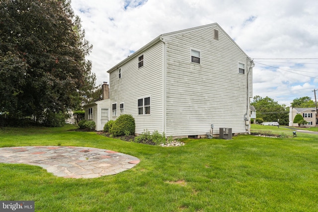1070 Decker Ln, Warminster, PA 18974 - view of property exterior featuring a patio area, a yard, central AC, and a chimney