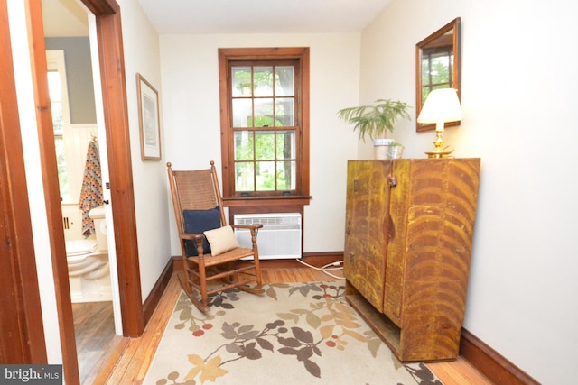 1598 Hollywood Dr, Lancaster, PA 17601 - sitting room with wood finished floors, baseboards, and a wall unit AC