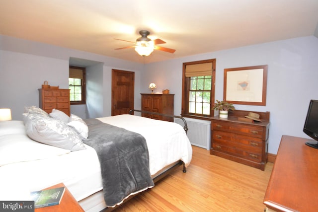 1598 Hollywood Dr, Lancaster, PA 17601 - bedroom with radiator, light wood-style floors, and ceiling fan