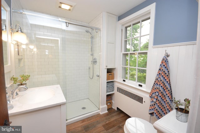 1598 Hollywood Dr, Lancaster, PA 17601 - full bath with radiator, wood finished floors, a shower stall, vanity, and toilet