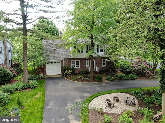 1598 Hollywood Dr, Lancaster, PA 17601 - view of front facade with asphalt driveway, brick siding, and a garage
