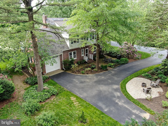 1598 Hollywood Dr, Lancaster, PA 17601 - view of front of house featuring driveway, brick siding, and a chimney