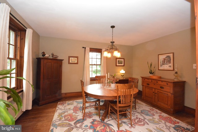 1598 Hollywood Dr, Lancaster, PA 17601 - dining area with light wood finished floors, a chandelier, and baseboards