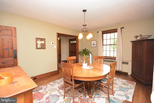 1598 Hollywood Dr, Lancaster, PA 17601 - dining area with radiator, wood finished floors, and baseboards