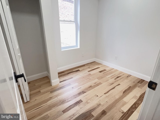 2015 S 23rd St, Philadelphia, PA 19145 - unfurnished bedroom featuring wood finished floors, baseboards, and a closet