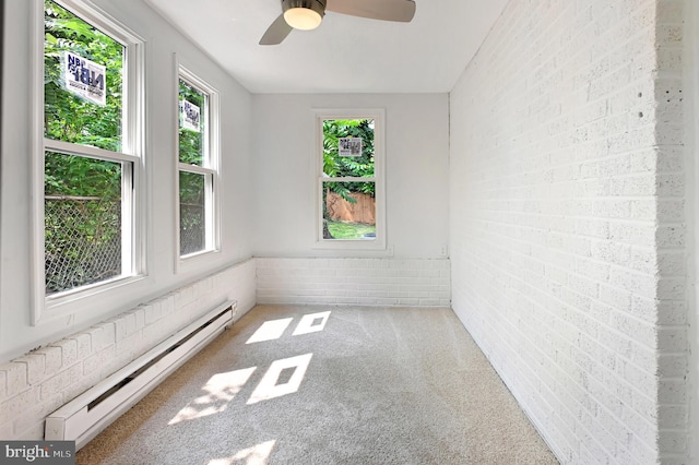 4504 Clay St NE, Washington, DC 20019 - carpeted empty room featuring a baseboard radiator, brick wall, ceiling fan, and wainscoting
