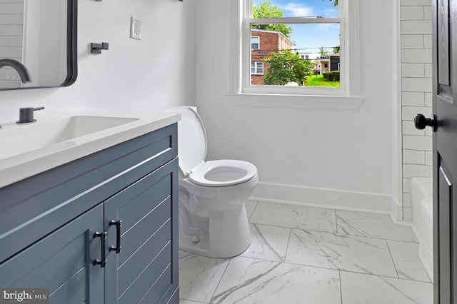 4504 Clay St NE, Washington, DC 20019 - full bath featuring vanity, toilet, marble look tile flooring, and baseboards