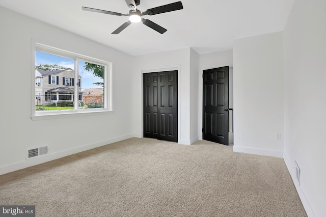 4504 Clay St NE, Washington, DC 20019 - unfurnished bedroom with light carpet, baseboards, a closet, and a ceiling fan