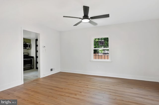 4504 Clay St NE, Washington, DC 20019 - unfurnished room featuring light wood-type flooring, baseboards, and a ceiling fan