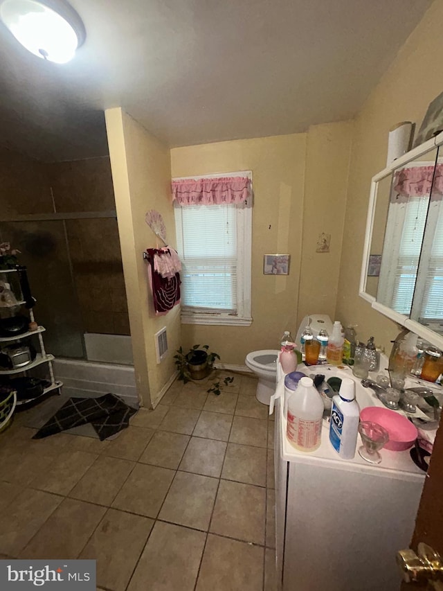 2844 N Hancock St, Philadelphia, PA 19133 - bathroom with tile patterned flooring, toilet, a shower stall, and vanity