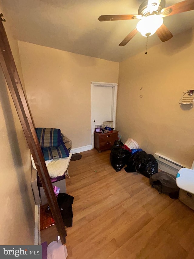 2844 N Hancock St, Philadelphia, PA 19133 - sitting room featuring a baseboard heating unit, light wood finished floors, and a ceiling fan