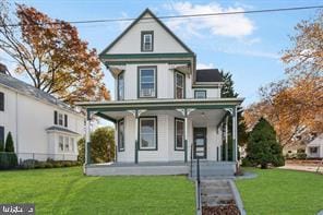 401 Fulton St, Hanover, PA 17331 - victorian home featuring a porch