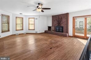 401 Fulton St, Hanover, PA 17331 - unfurnished living room featuring wood finished floors, a ceiling fan, baseboards, and a brick fireplace
