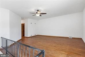 401 Fulton St, Hanover, PA 17331 - unfurnished living room featuring wood finished floors, ceiling fan, and baseboards