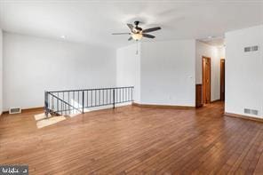 401 Fulton St, Hanover, PA 17331 - unfurnished living room featuring wood finished floors, baseboards, and a ceiling fan