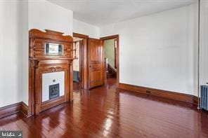 401 Fulton St, Hanover, PA 17331 - unfurnished living room featuring wood finished floors and baseboards