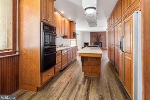 401 Fulton St, Hanover, PA 17331 - kitchen featuring dark wood finished floors, brown cabinets, and a kitchen island