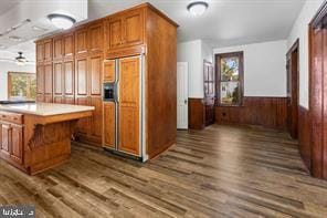 401 Fulton St, Hanover, PA 17331 - kitchen with paneled built in fridge, brown cabinetry, dark wood finished floors, light countertops, and wainscoting