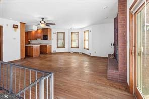 401 Fulton St, Hanover, PA 17331 - unfurnished living room with wood finished floors and ceiling fan
