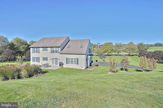 4408 Irish Creek Rd, Bernville, PA 19506 - rear view of house featuring a patio, a lawn, and roof with shingles